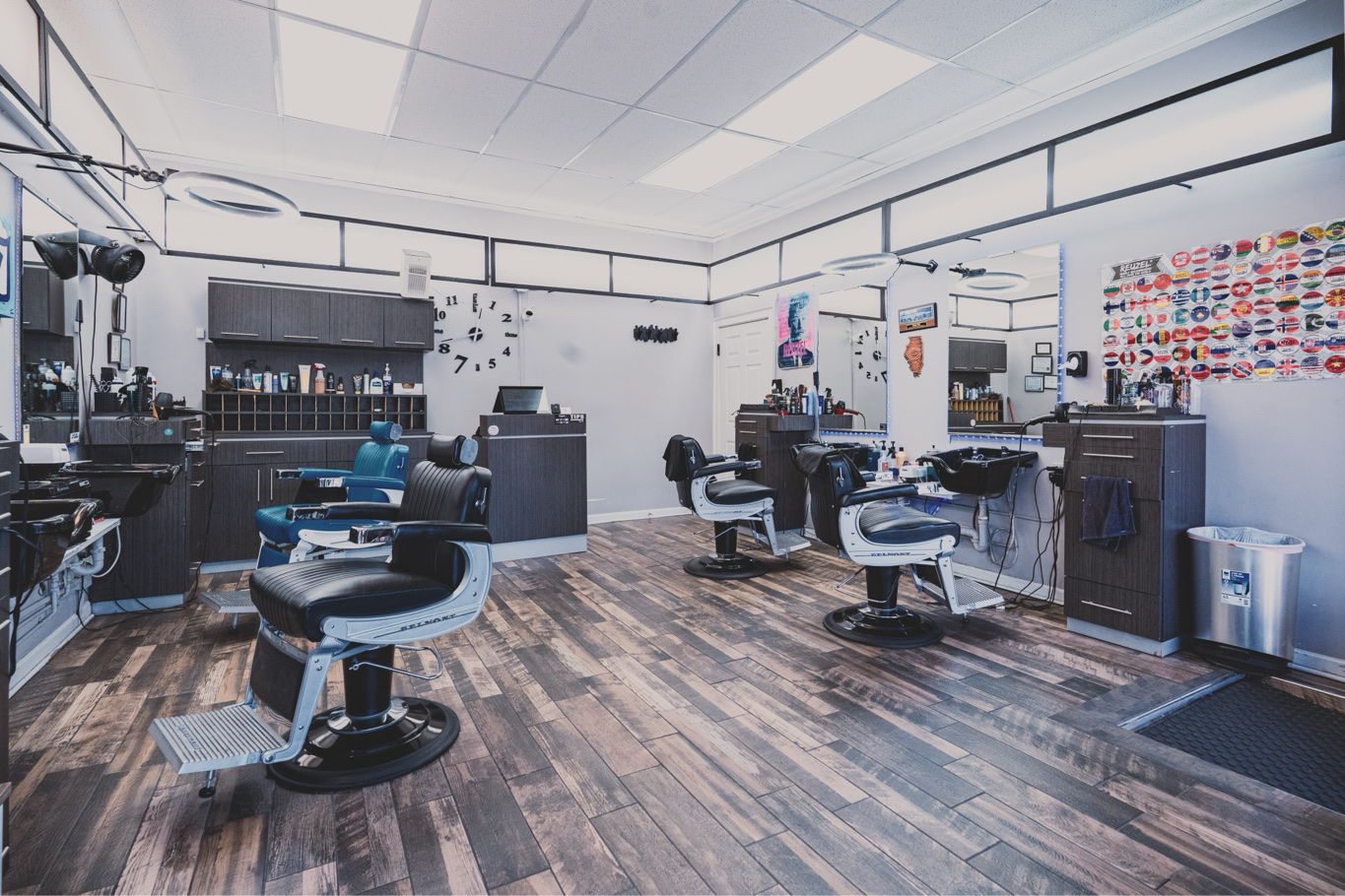 Inside W Hair Room barbershop in Wrigleyville, Chicago — barber chairs, stations, and warm wood floors